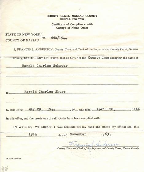 Certificate from the Nassau County Clerk that the court order changing the name of Harold Charles Schnuer to Harold Charles Shore was complied with. The order was filed April 20, 1944 and took effect May 29, 1944 (No. 880/1944). This certificate was issued November 19, 1963.