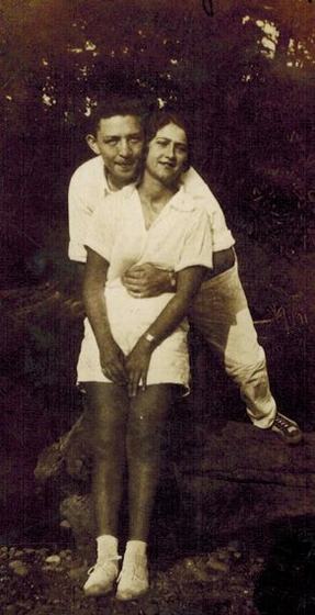 Harold and Mae, young, in the woods.