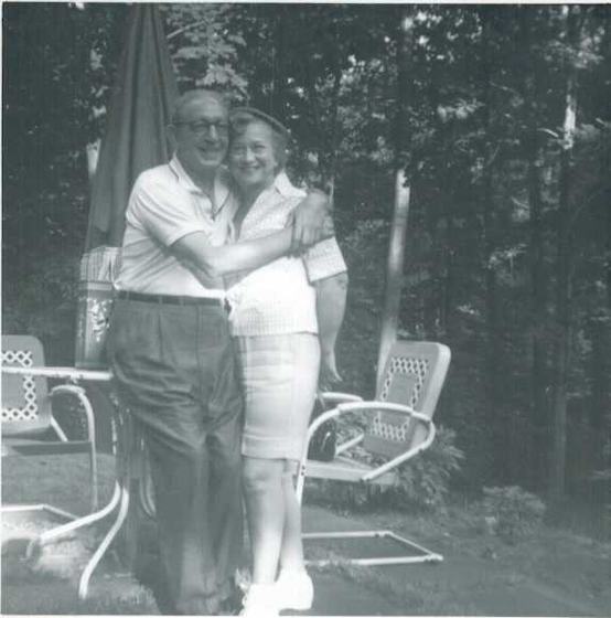 Harold and Mae in a wooded yard.
