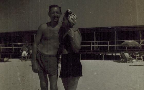 Harold and Mae at the beach, Mae in a headscarf.