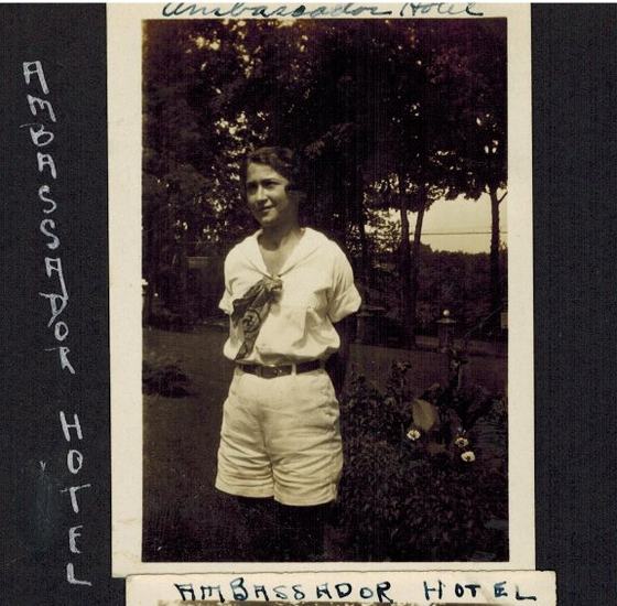 Mae in the garden of the Ambassador Hotel. An album page.