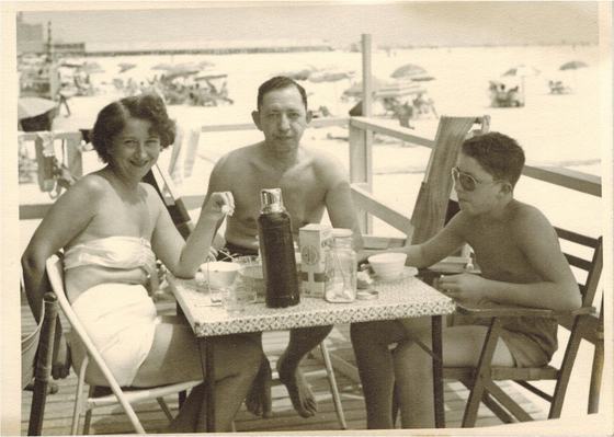 Mae, Harold and Warren at a table on the beach boardwalk.