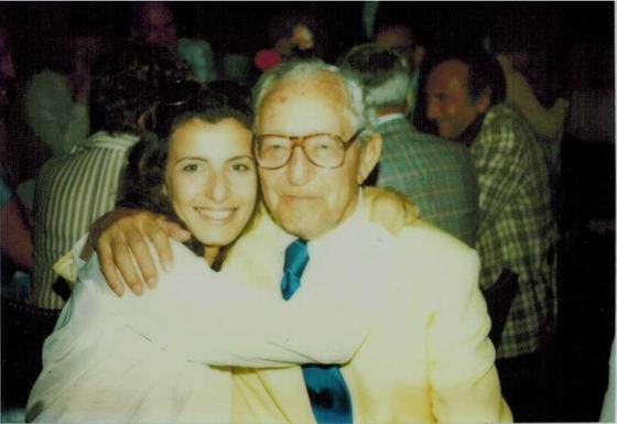Harold with Toby, his daughter-in-law, in a warm hug at a party.